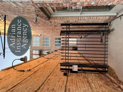 a large empty room with a metal rack on the floor at Strongback Suite 207 in Adrian