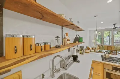 a large kitchen with wooden counters and a sink at The Urban Oasis - 2 BR - Great Location in Columbus