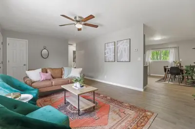 a living room with a couch and a ceiling fan at Bright and Breezy Gahanna Ranch 10min to INTEL in Columbus