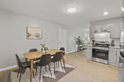 a kitchen and dining room with a table and chairs at Bright and Breezy Gahanna Ranch 10min to INTEL in Columbus