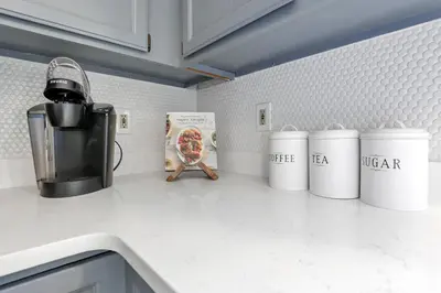 a kitchen counter top with a box of pizza on it at Gahanna Dreaming - 5Br 2 Ba INTEL in Gahanna