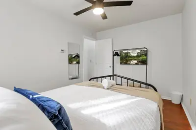 a white bedroom with a bed and a ceiling fan at Gahanna Dreaming - 5Br 2 Ba INTEL in Gahanna