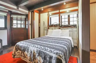 a bedroom with a large bed in a room at The City Cabin - Unique and Historic in Columbus