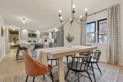 a dining room and kitchen with a table and chairs at Gahanna Farmhouse - 4 Bed 2 Bath - INTEL in Columbus