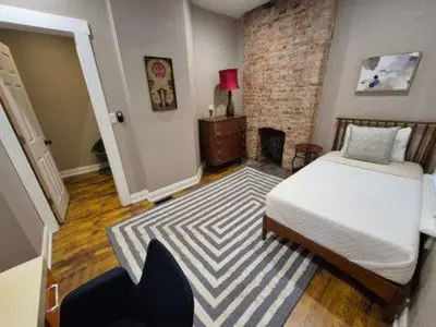 a bedroom with a bed and a rug at The Goodale Retreat - 2 BR 2Bath in Columbus