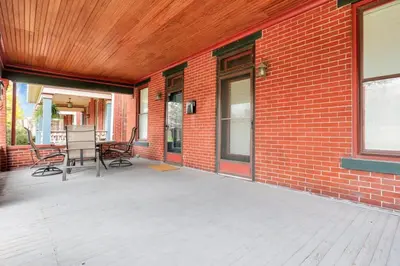 a patio with chairs and a brick building at The Goodale Retreat - 2 BR 2Bath in Columbus
