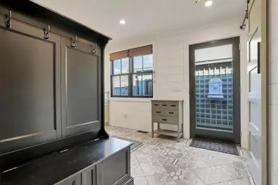 a large room with a dresser and a window at The Mohawk Masterpiece in Columbus
