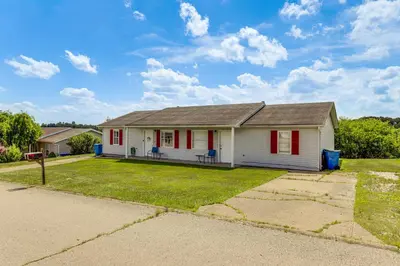 a white house with red shutters at Quiet Dry Ridge Home with Yard - Near Ark Encounter! in Dry Ridge