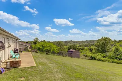 a view of a yard with a house at Quiet Dry Ridge Home with Yard - Near Ark Encounter! in Dry Ridge