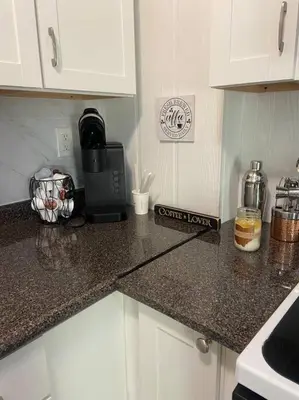 a kitchen counter top with a coffee maker on it at 102 Acre Pet Friendly Horse Farm! Bring your horse too! in Lebanon