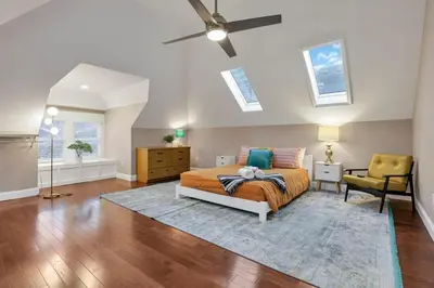a bedroom with a bed and a ceiling fan at The Goodale House - 2 Units - 4 BR 5 Bath in Columbus