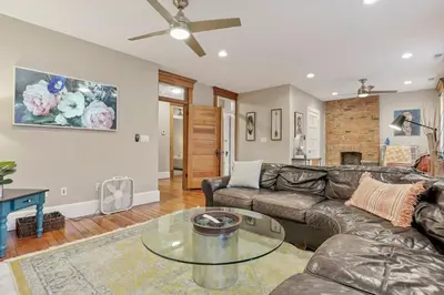 a living room with a couch and a glass table at The Goodale House - 2 Units - 4 BR 5 Bath in Columbus