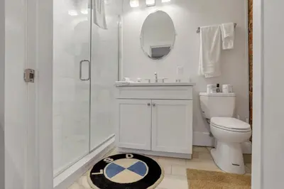 a bathroom with a shower and a toilet and a sink at The Goodale Overlook in Columbus