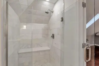 a bathroom with a shower with a glass door at The Goodale Overlook in Columbus