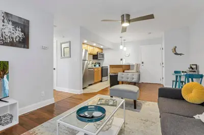 a living room with a couch and a table at Cozy 2 BR in Short North Convenient Parking in Columbus