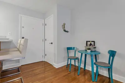 a dining room with a blue table and chairs at Cozy 2 BR in Short North Convenient Parking in Columbus