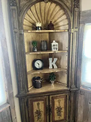a large wooden cabinet with a clock on it at Cabin with Character in New Lexington