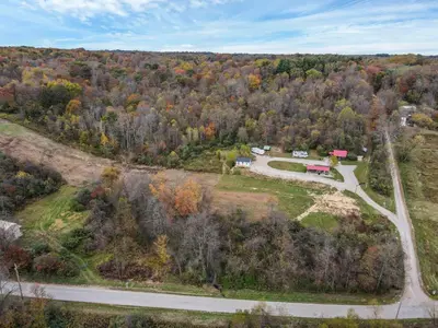 an aerial view of a house and a road at Cabin with Character in New Lexington