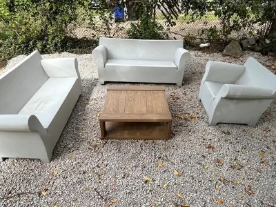 three white couches and a coffee table in a yard at Sunny Lavender Canopy Retreat in Cleveland