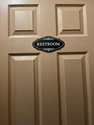 a close up of a door with a sign on it at Stained Glass Serenity Suite in Cleveland