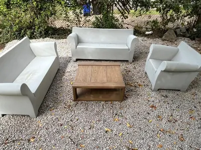 three couches and a coffee table in a yard at Stained Glass Serenity Suite in Cleveland