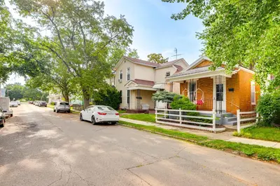a white car parked in front of a house at Dog-Friendly Dayton Home 1 Mi to Downtown! in Dayton