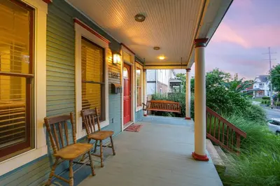 two chairs on the porch of a house at Home with Garage, Hot Tub, near OSU & Short North in Columbus