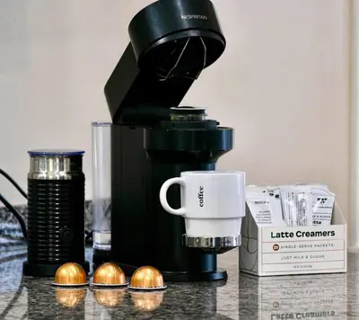 a coffee maker sitting on a counter with a cup at El Retro- Mid Century Ranch near Horse Park & Rupp in Lexington