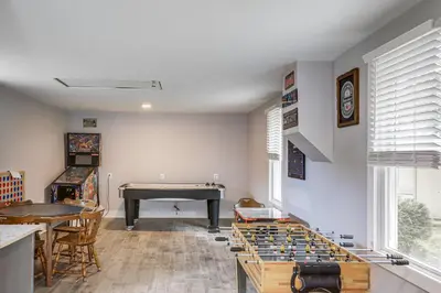 a room with a ping pong table and a pool table at 3 Mi to Cedar Point Sunny Sandusky Home with Yard in Sandusky