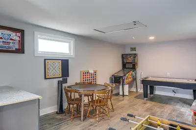 a room with a ping pong table and a ping pong table at 3 Mi to Cedar Point Sunny Sandusky Home with Yard in Sandusky