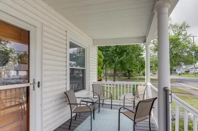 a porch with chairs and a table on it at 3 Mi to Cedar Point Sunny Sandusky Home with Yard in Sandusky