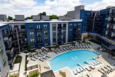 an aerial view of a building with a pool and chairs at Stylish apartments near shops and entertainment in Cincinnati