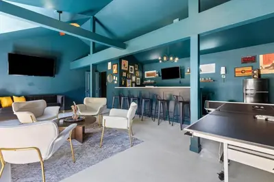 a room with a bar with chairs and a table at The Luxe Hot Tub Private Bar 12 Min to Horse Park in Georgetown