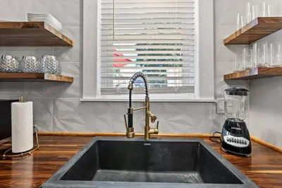 a kitchen counter with a sink and a window at The Luxe Hot Tub Private Bar 12 Min to Horse Park in Georgetown