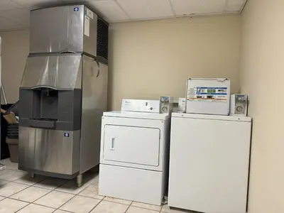 a kitchen with two refrigerators and a refrigerator at Sycamore Suites in Elyria