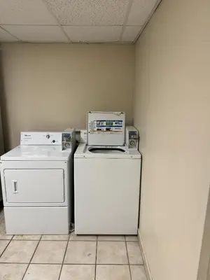 two appliances sitting on top of each other in a room at Sycamore Suites in Elyria