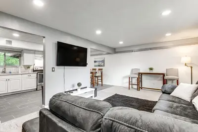a living room with a couch and a tv at 4 Mi to MetroParks Ice Rink Pet-Friendly Getaway in Dayton