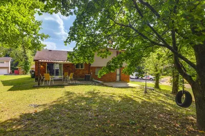 a home with a yard with a house at 4 Mi to MetroParks Ice Rink Pet-Friendly Getaway in Dayton