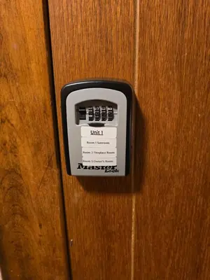 a button on a wooden door with a switch at Unit 1 at Oilgate at Oakdale in Akron