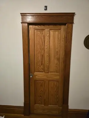 a wooden door with a clock on top of it at Unit 1 at Oilgate at Oakdale in Akron