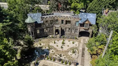 an overhead view of an old stone house with a garden at Enchanted Castle - Your Royal Getaway Awaits in Cleveland