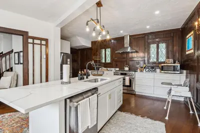 a kitchen with a sink and a counter top at Enchanted Castle - Your Royal Getaway Awaits in Cleveland