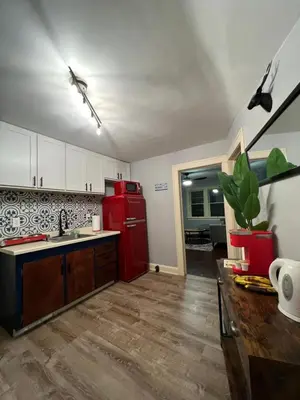 a kitchen with a red refrigerator and a sink at Parma duplex cozy retreat in Parma