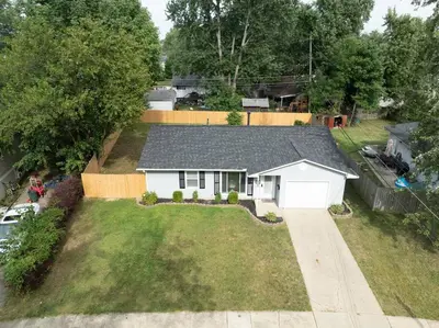 an aerial view of a house with a yard at Private Ranch- Entire Home - Hot Tub - Pets & Kids Welcome - King Bed - Fenced Backyard - Free WiFi in Gahanna