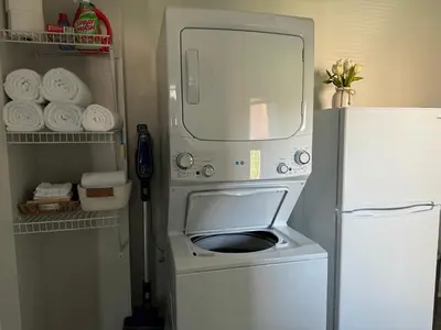 a refrigerator with its door open in a kitchen at Downtown Willoughby Historic District Gem #2 in Willoughby