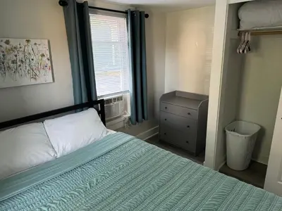 a small bedroom with a bed and a window at Downtown Willoughby Historic District Gem #2 in Willoughby