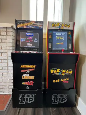 four video game machines sitting next to each other at House with 10 Beds Sleeps 16 free Driveway Parking in Cincinnati