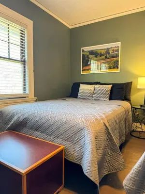 a bedroom with a bed and a window at Spacious 3 Bedroom Sleeps 12 with 7 Beds plus Parking in Dayton