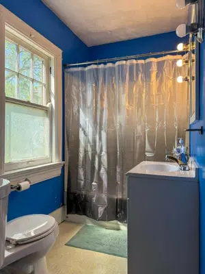 a bathroom with a shower and a sink and a toilet at Spacious 3 Bedroom Sleeps 12 with 7 Beds plus Parking in Dayton