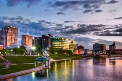 a city skyline with a river and buildings at Spacious 3 Bedroom Sleeps 12 with 7 Beds plus Parking in Dayton